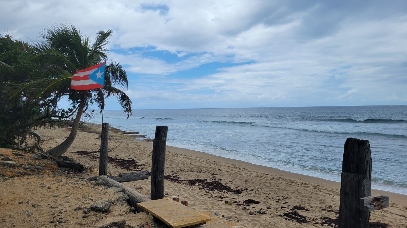 Puerto Rican flag flying on a beach