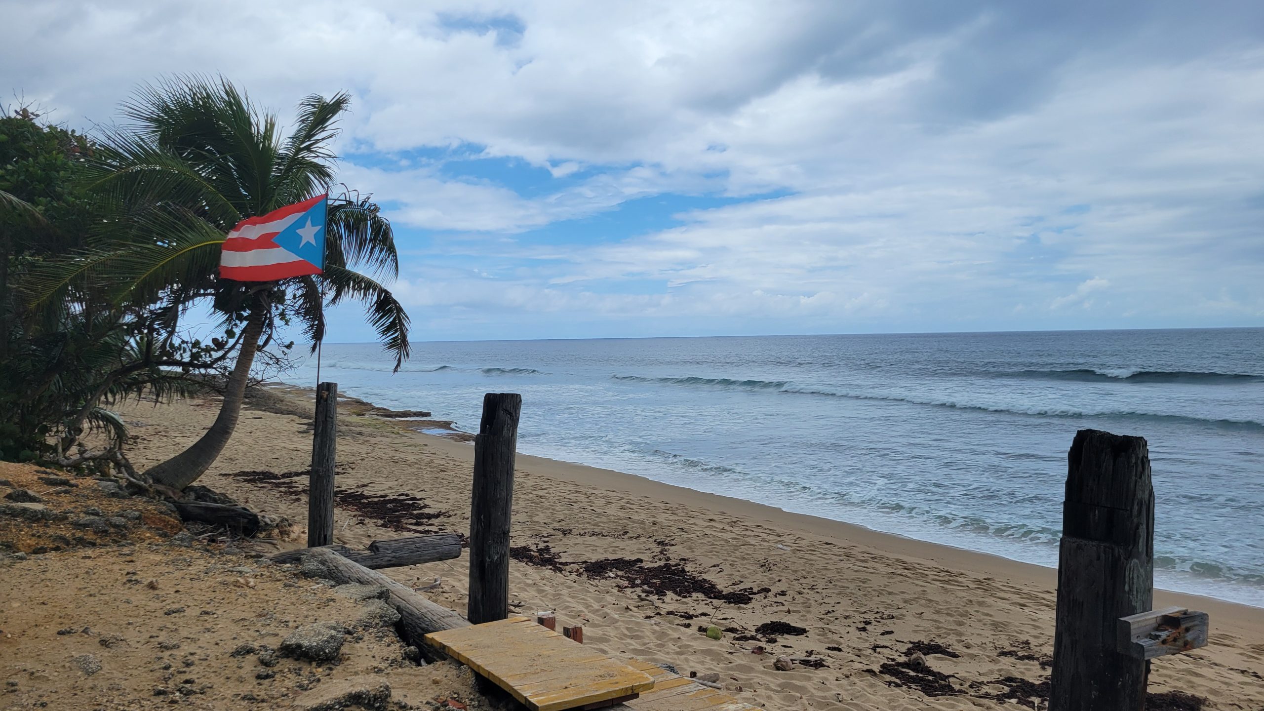 Puerto Rican flag flying on a beach