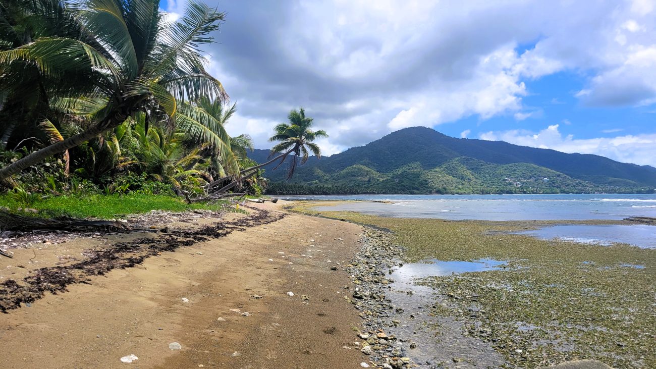 Secluded beach with mountains in the distance